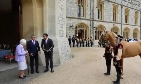 ‘Glory!’ Queen pictured beaming as she’s presented with majestic rare horse