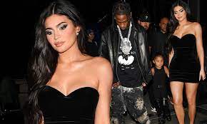 Kylie Jenner ‘dripping’ in black dress as she holds hands with daughter Stormi and beau Travis Scott in London