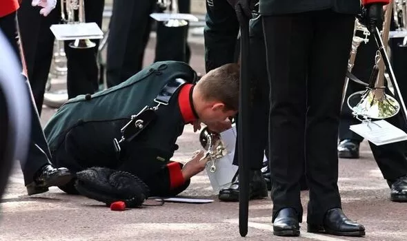 Soldier collapses in street as Queen Elizabeth’s coffin is driven to Windsor