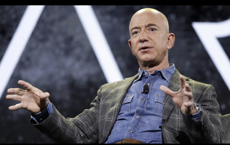 Jeff Bezos vows to give away most of fortune – and hands Dolly Parton $100m 