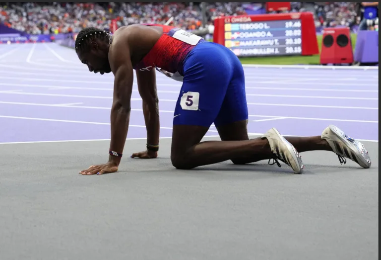 Lyles suffering from COVID, wins bronze